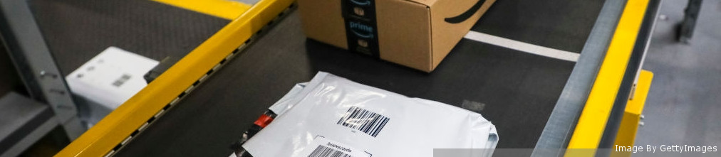 Boxes and packages moving on transporter tape in Amazon fulfillment center