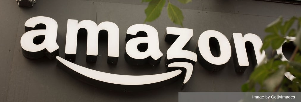 Amazon.com building with huge Amazon logo sign on dark background
