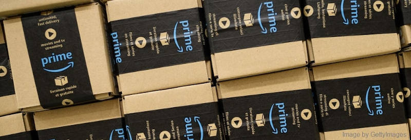 Small, square boxes with black and blue Amazon Prime stickers on it